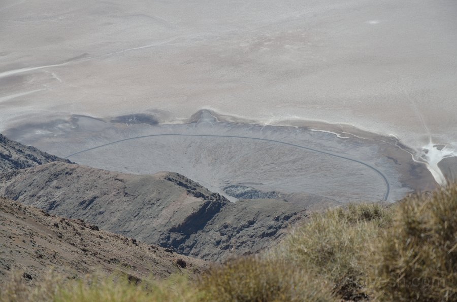 HJS_3731.JPG - View of the Badwater Salt Basin. The Whites that you see are dried up salt crystals. The black/dark grey curve is the road.